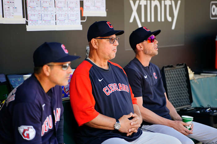 Jun 5, 2022; Baltimore, Maryland, USA; Cleveland Guardians manager Terry Francona (77) sits on the bench with Cleveland Guardians third base coach Mike Sarbaugh (16) and Cleveland Guardians assistant coach Kyle Hudson prior to the game against the Baltimore Orioles at Oriole Park at Camden Yards. Mandatory Credit: Gregory Fisher-USA TODAY Sports